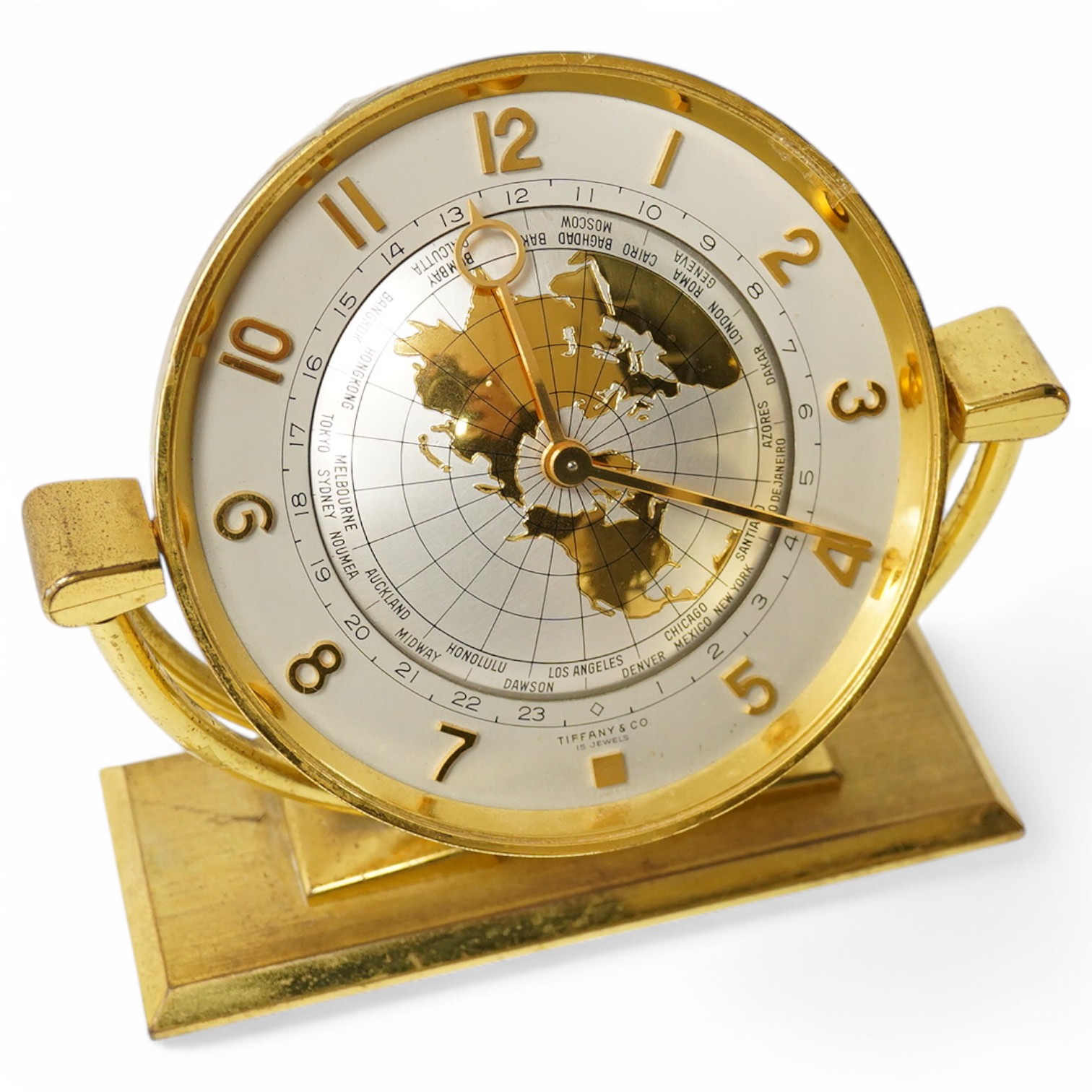 Tiffany and Co gilt metal ‘world’ alarm clock,15.5cm high. Condition - wear to lacquered finish, clock untested if working.